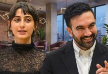“Mamdani Curse” Explodes Across New York…. Two professionals engaged in conversation in a modern office setting