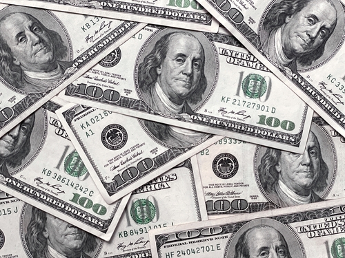 shutterstock_2476057625.jpg A pile of hundred dollar bills featuring Benjamin Franklin