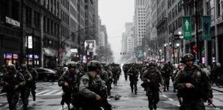 A large group of armed soldiers running through a city street