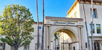 Paramount Pictures entrance gate with ornate architecture and trees.