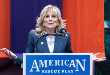Grand Jury Shock Rattles Biden Orbit Woman speaking at a podium with a microphone