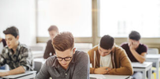 Students taking a test in a classroom.