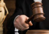 Gavel being struck on a sound block.