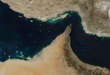 Trump’s Iran Threats Draw Legal Scrutiny Satellite view of the Strait of Hormuz and surrounding coastlines