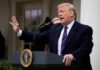 Ukraine Seeks More Trump Backing person speaking at a podium outdoors