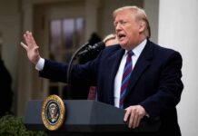 Ukraine Seeks More Trump Backing person speaking at a podium outdoors