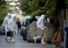 Mercury Scare Ends With Unexpected Truth forensic investigators in white protective suits walking on a city street
