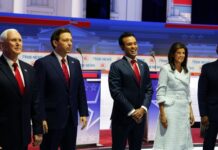 Public figures stand in line at a Fox News event.