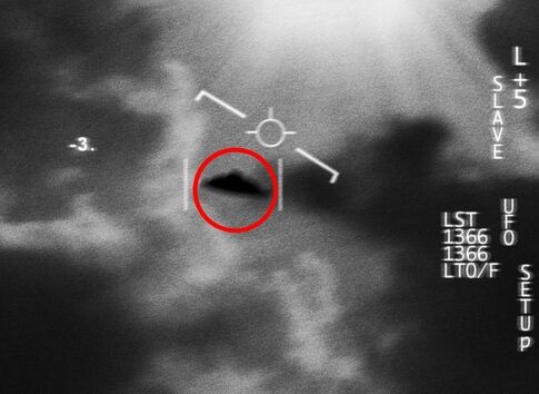 A blurry image of a UFO captured in the sky with a circular red highlight