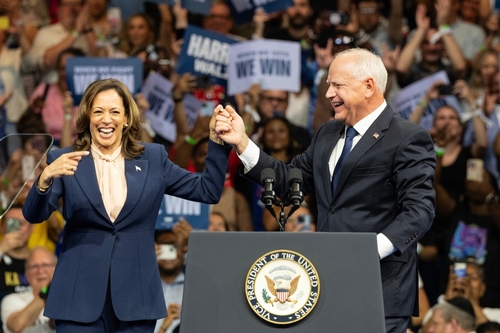 Kamala Harris and Joe Biden celebrate onstage.