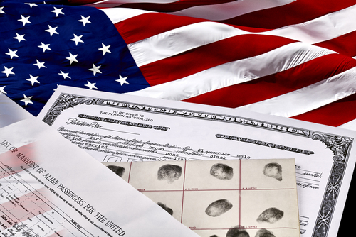 American flag with identification documents and fingerprint records.